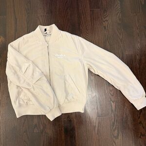 Ariana Grande Cream Interior Logo Bomber